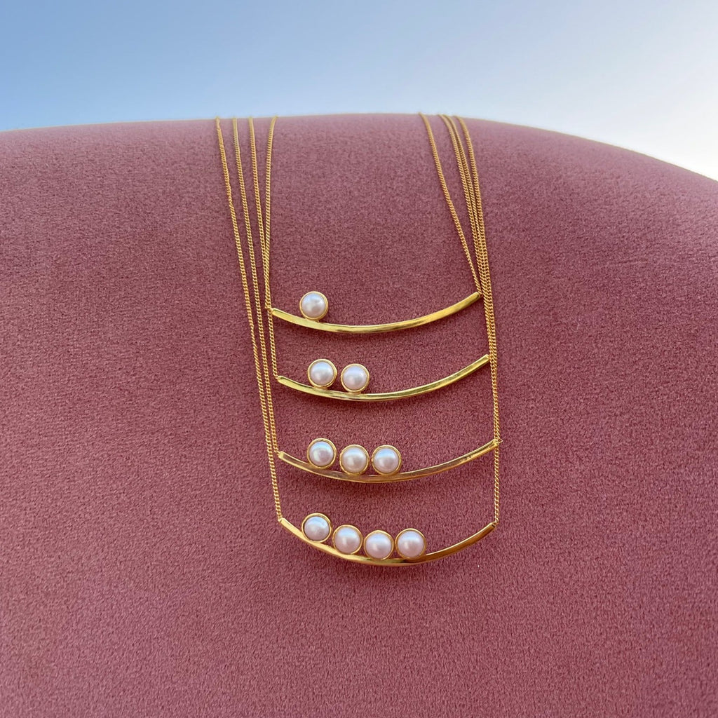 Breastfeeding we did it necklace! 4 versions available with 1, 2,3 & 4 pearls. Pearls resting on top of gold bar. Sterling silver/ gold plated. 