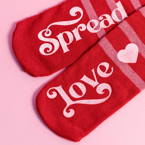 One-size-fits-all socks. 80% Cotton, 15% Polyester, 5% Spandex.
