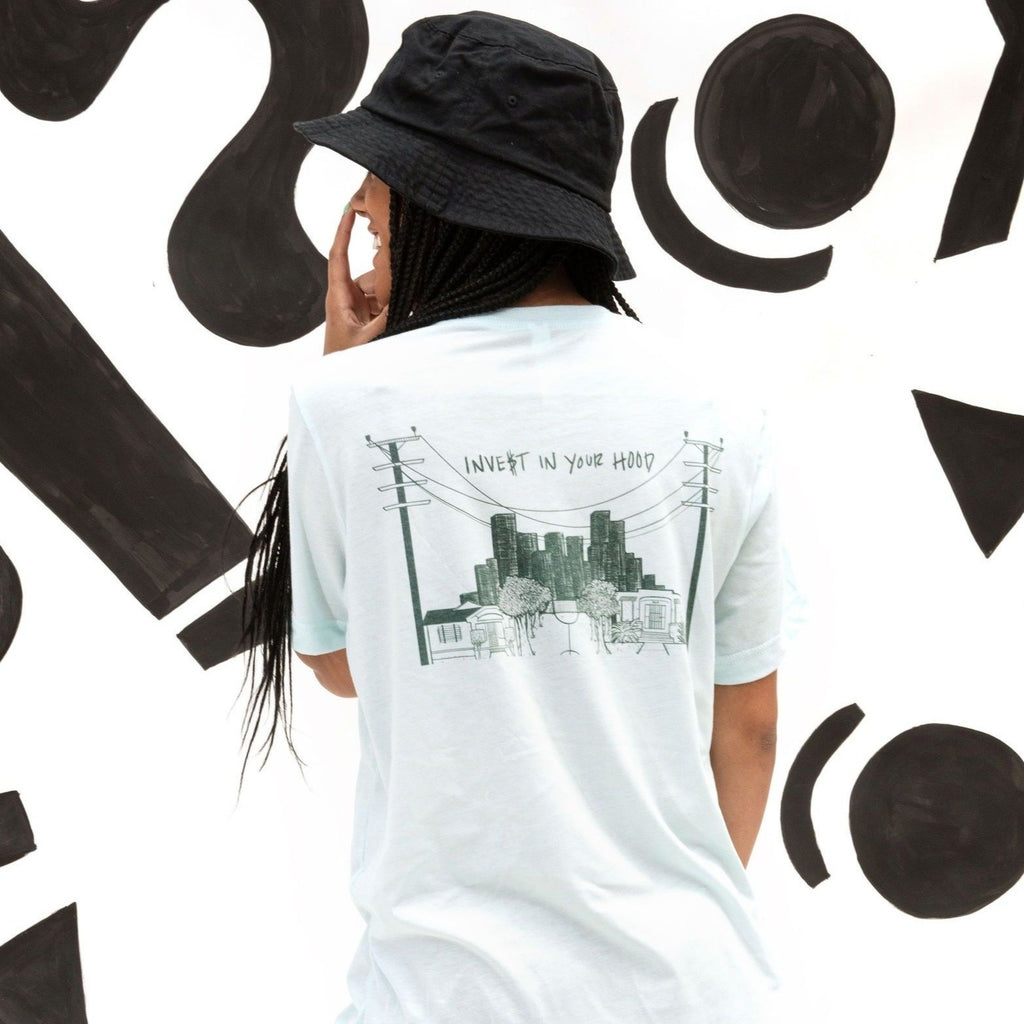 Model is wearing INVE$T IN YOUR HOOD soft blended blue tee 50% poly 50% airlume combed cotton Crew neck, stretchy