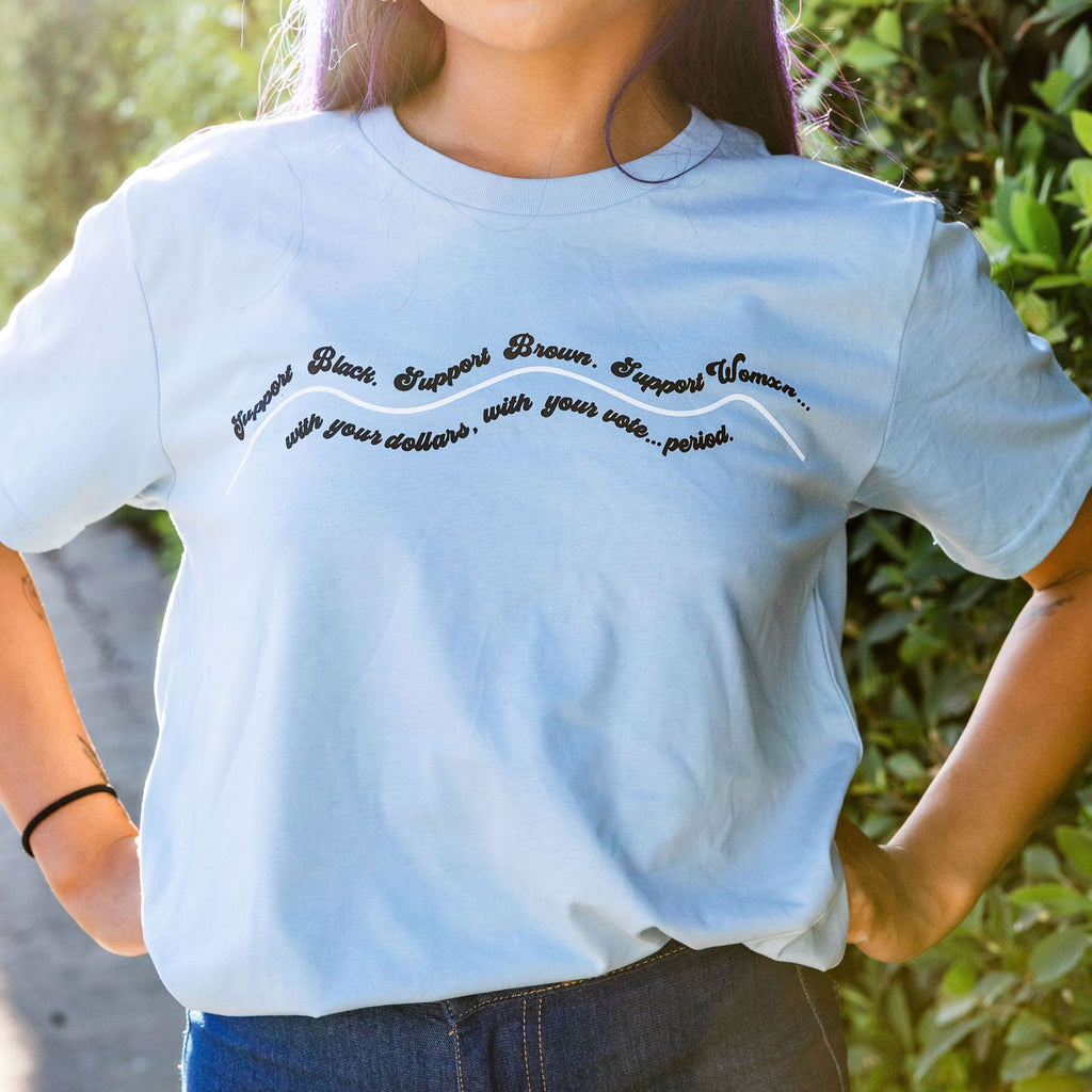 Model is wearing support Black, Brown, Womxn Tee in blue 100% Cotton Unisex tee.  Pre-shrunk, regular fit, crew neck, true to size.