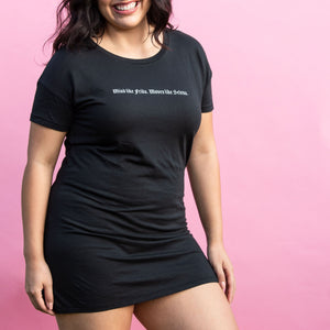 Model is wearing Mind Like Frida. Moves Like Selena. Black t-shirt dress. 60% cotton, 40% TENCEL™ Modal. Available in size S to XL